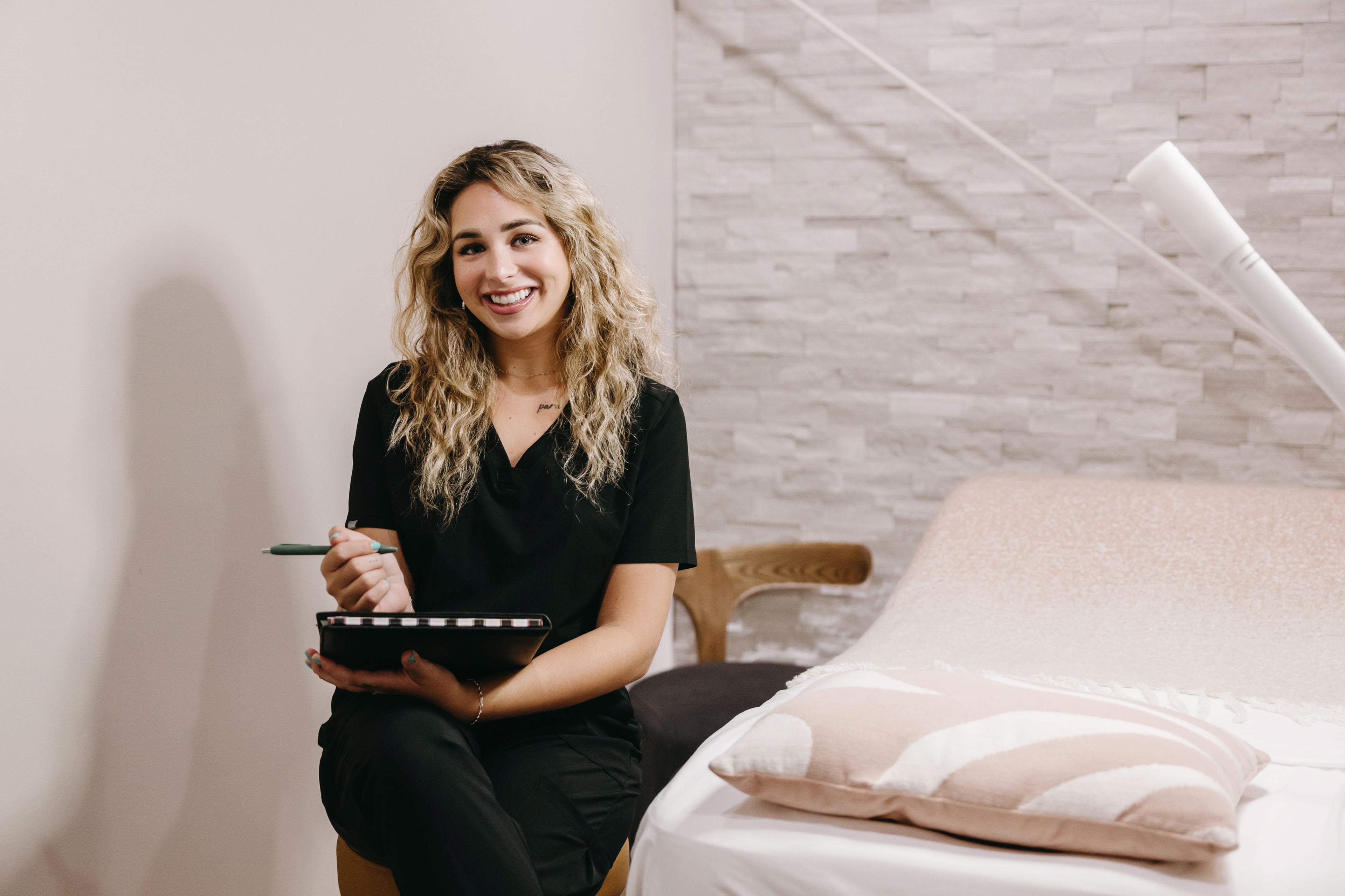 Woman holding a clipboard in a medical spa setting
